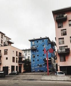 Houses against sky in city