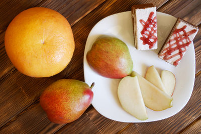 High angle view of fruits in plate on table