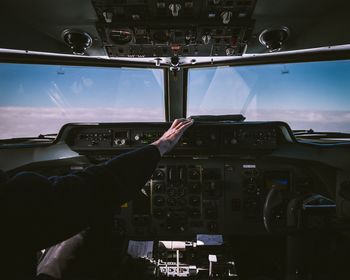 Person in cockpit of airplane