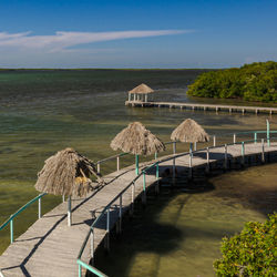 Scenic view of river pier against sky