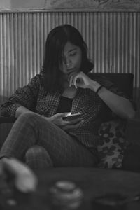 Young woman lying on sofa