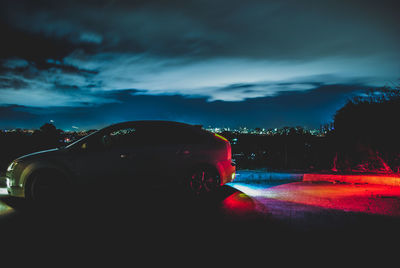 Cars on road against sky