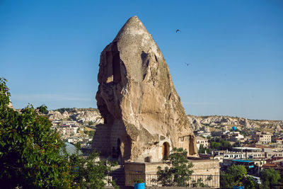 Old town of goreme in turkey houses and the fortress in the summer in sunny weather
