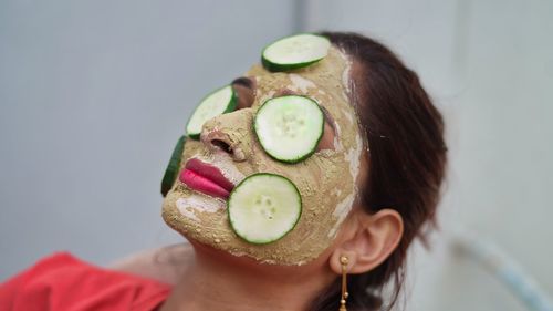 Midsection of woman holding flower