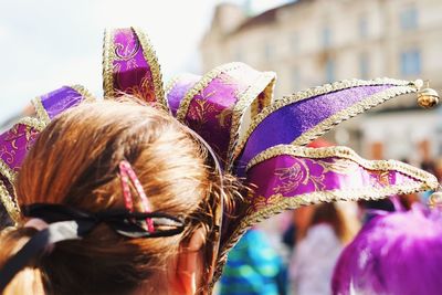 Rear view of woman wearing mask during carnival