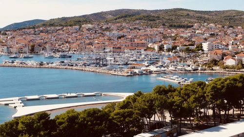 Aerial view of townscape by sea