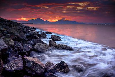 Scenic view of sea against sky during sunset