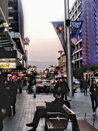 City street and buildings against sky