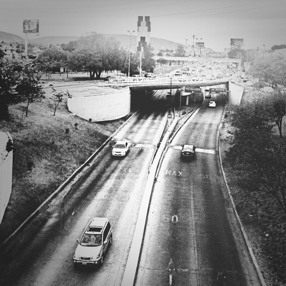 transportation, mode of transport, land vehicle, car, road, high angle view, on the move, travel, street, road marking, city, traffic, built structure, the way forward, incidental people, tree, architecture, journey, day, outdoors