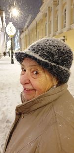 Portrait of smiling woman in snow