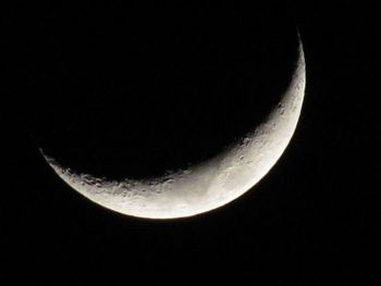 Scenic view of moon against clear sky at night