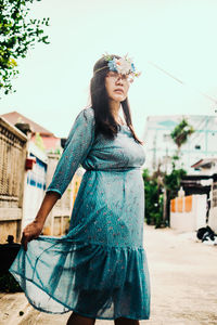 Young woman standing outdoors