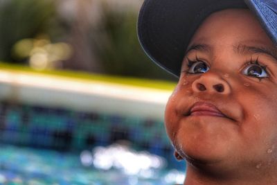 Close-up portrait of boy wearing hat