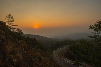 Scenic view of landscape against sky during sunset