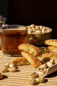 Biscotti cantuccini cookie biscuits with pistachios and lemon peel shortbread. cup of tea. teatime