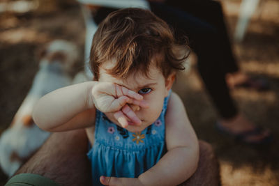 High angle view portrait of cute baby girl with father