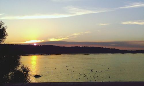 Scenic view of sunset over lake