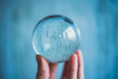 Close-up of human hand holding ball