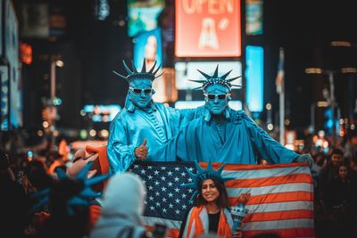 Group of people in front of building at night