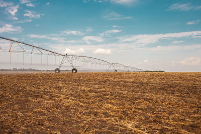 Moved irrigation system on a farmer's field. field irrigation with a pivot sprinkler system. 