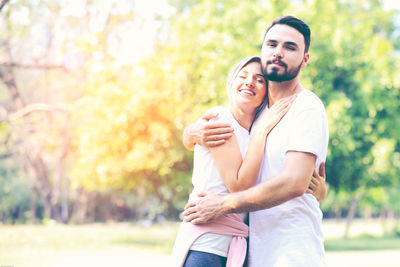 Happy couple standing outdoors