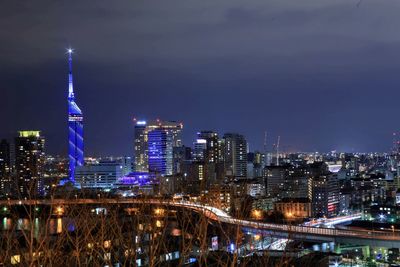 Illuminated buildings in city at night