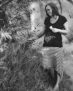 Woman standing on grass