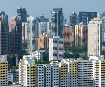 Modern buildings in city against sky