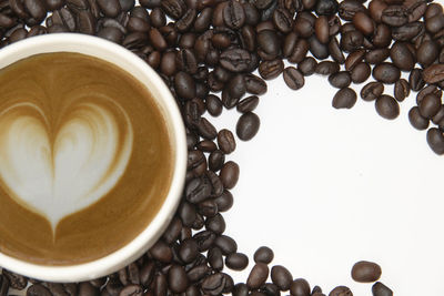 Close-up of coffee beans against white background