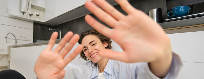 Cropped image of woman using mobile phone