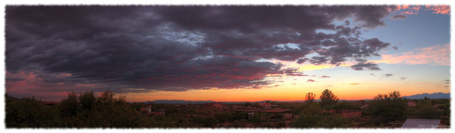 Scenic view of cloudy sky at sunset