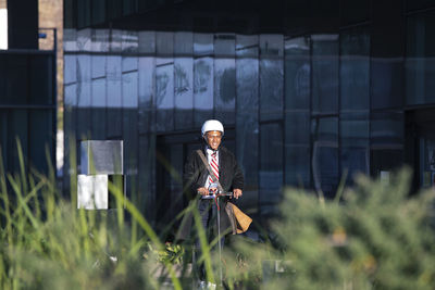 Rear view of woman walking on field