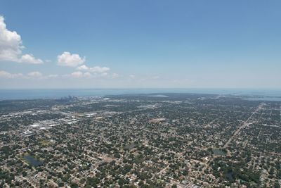 Aerial view of city buildings against sky