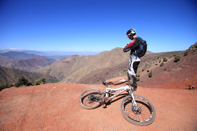 Man riding motorcycle on landscape