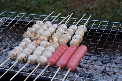 High angle view of meat on barbecue grill