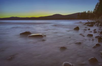 Scenic view of sea against sky during winter