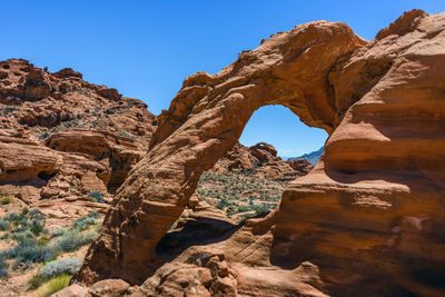 Low angle view of rock formation against clear sky