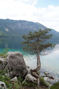 Scenic view of lake and mountains against sky