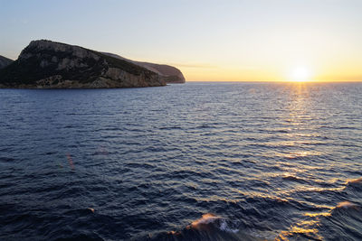 Scenic view of sea against clear sky during sunset