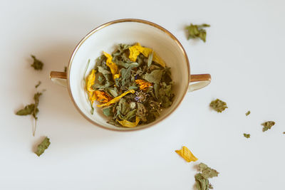 High angle view of tea on table against white background