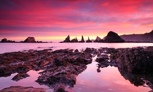 Sunrise on gueirua beach in asturias, spain.