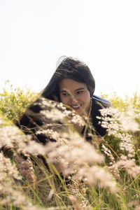 Portrait of smiling young woman on field