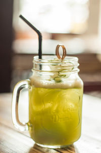 Close-up of glass of jar on table