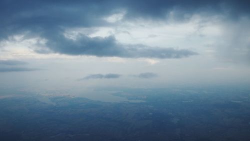 Scenic view of sea against cloudy sky