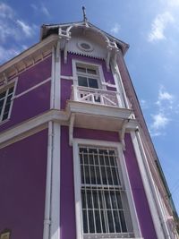 Low angle view of clock tower against sky