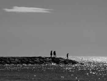 Man on sea against clear sky