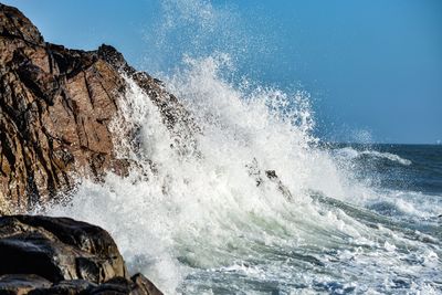 Sea waves splashing on rocks