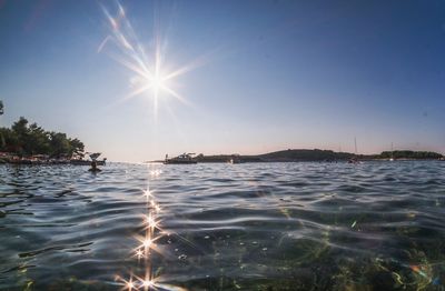 Sun shining over sea