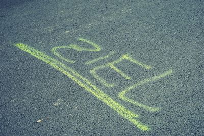 High angle view of text on street