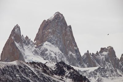 Scenic view of snowcapped mountains against clear sky